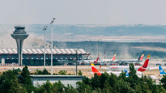 Frankfurt, Germany - October 18, 2018: Airport crash tender SIMBA and plane dummy in flames during a fire drill at FTC (Feuerwehr Training Center). The SIMBA is a large airport fire truck from the Austrian manufacturer Rosenbauer International AG. The FTC (Feuerwehr Training Center) is located at Runway Northwest, nearby fire station 4. Frankfurt International Airport is the largest airport in Germany.