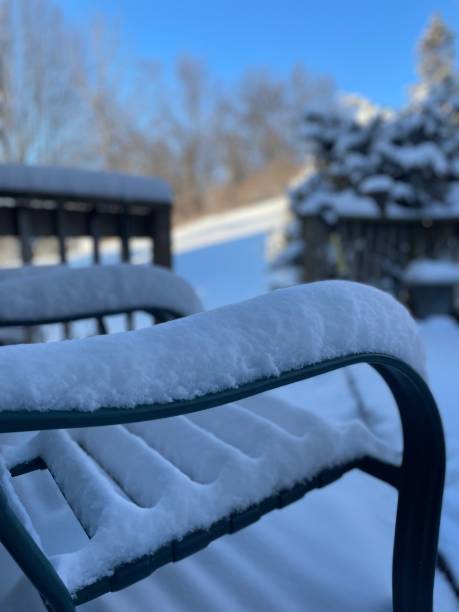 istock Outdoor chair and deck covered with snow 1440785271