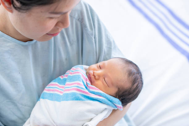 istock Newborn in Mothers Arms 1440786625