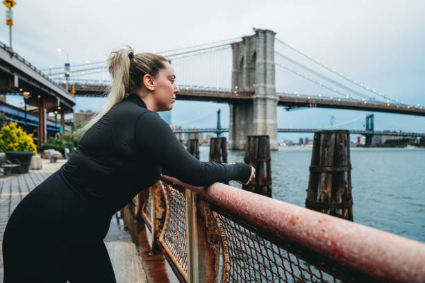 istock A young woman is resting in the city after a training session 1440789530