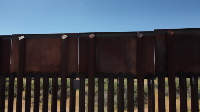 Drone Flyover Close Up of International Border Wall in Eastern New Mexico and Mexican State of Chihuahua on a Sunny Day