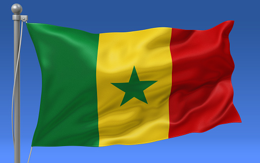 Senegal flag waving on the flagpole on a sky background