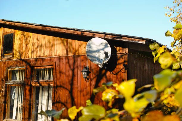 Old satellite and television antennas on the balcony of a poor dwelling