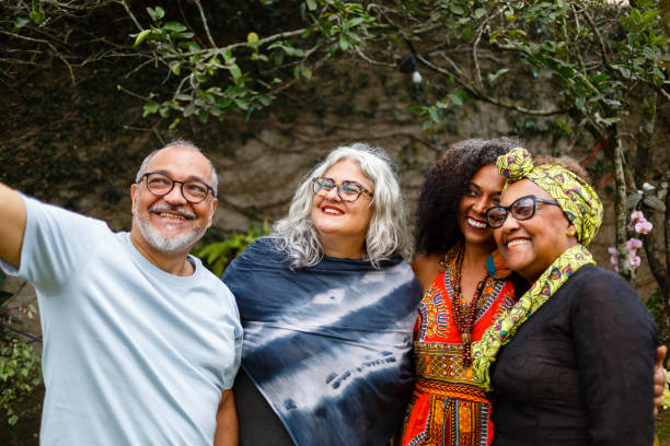 istock Group of friends taking a selfie at a backyard party 1440791775
