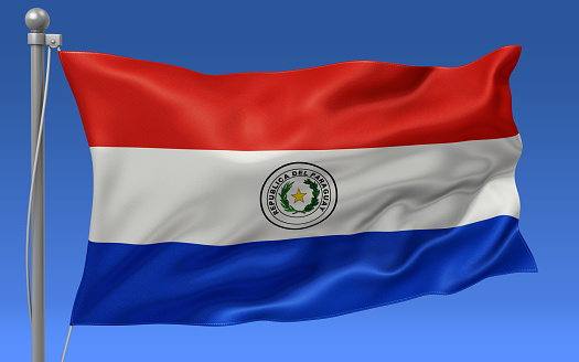 Paraguay flag waving on the flagpole on a sky background