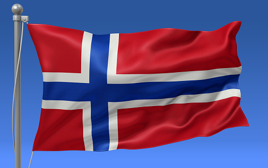 Norway flag waving on the flagpole on a sky background