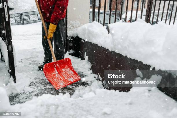 Man With Snow Shovel Stock Photo - Download Image Now - 20-24 Years, Adult, Adults Only