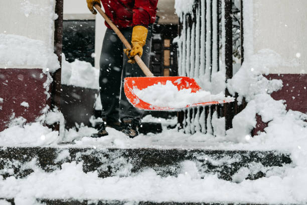 istock Man with snow shovel 1440797800