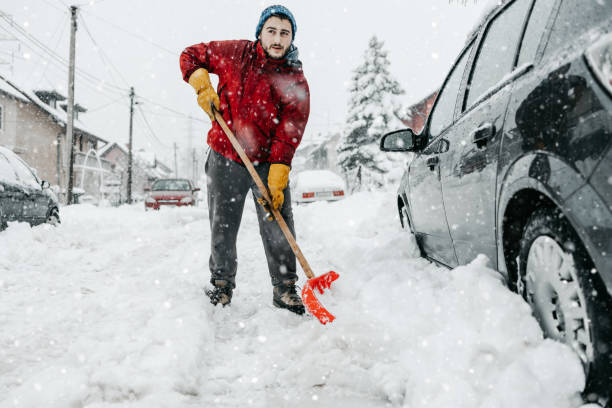 istock Man with snow shovel 1440797850