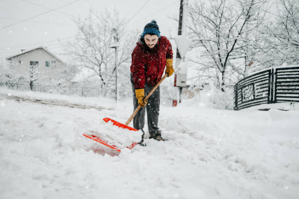 Man with snow shovel stock photo