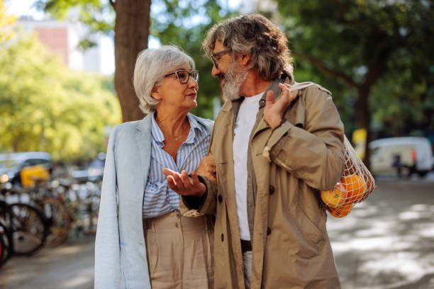 istock Senior couple in conversation outside. 1440799850