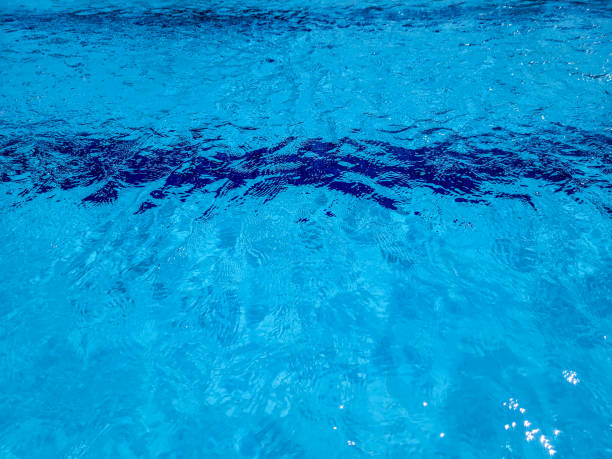 istock water background with sunlight reflections and abstract shapes 1440803803