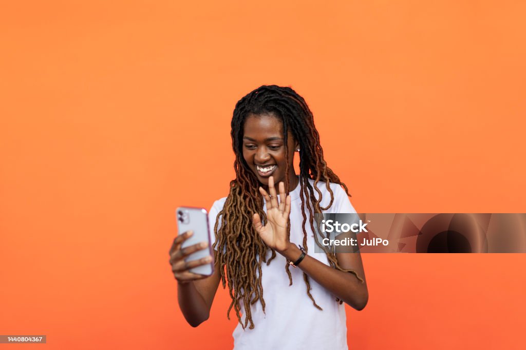 Young Black woman using phone 20-24 Years Stock Photo