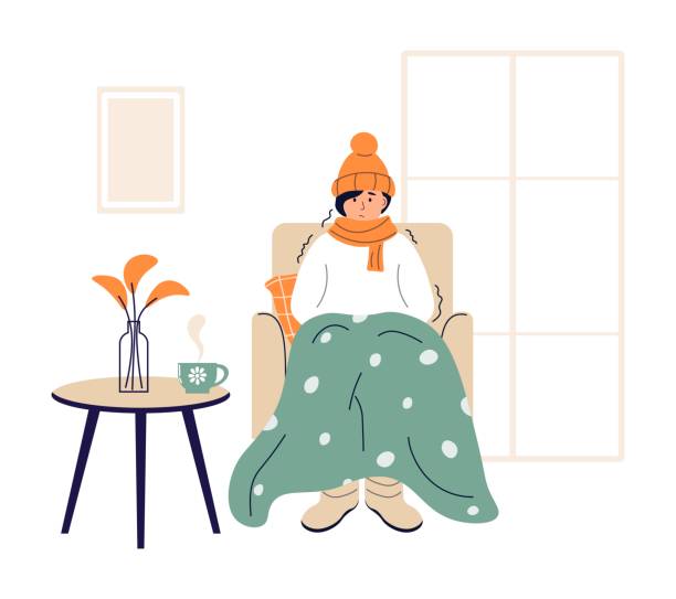 Young woman wrapped in plaid. Frozen female character in hat and scarf. Low temperature at home. Person freezes from cold warming up with hot drink. Girl sitting in armchair, shivering from cold. Young woman wrapped in plaid. Frozen female character in hat and scarf. Low temperature at home. Person freezes from cold warming up with hot drink. Girl sitting in armchair, shivering from cold. shivering stock illustrations