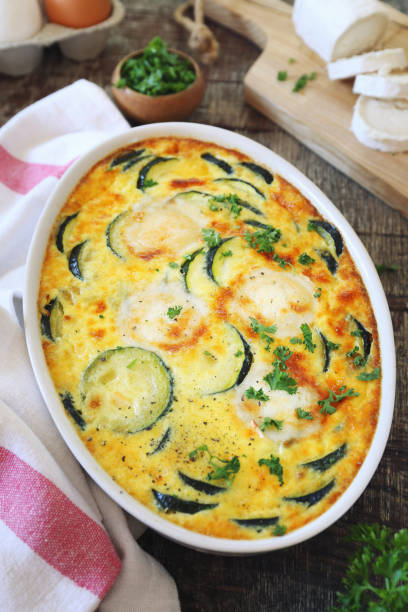 istock French cuisine. Vegetable zucchini clafoutis with goat cheese in ceramic bakeware 1440805787