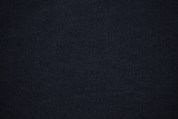 istock texture of black colored jeans denim fabric background 1440809402