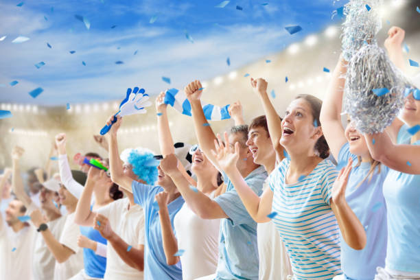istock Football team supporter. Blue and white stadium. 1440809785