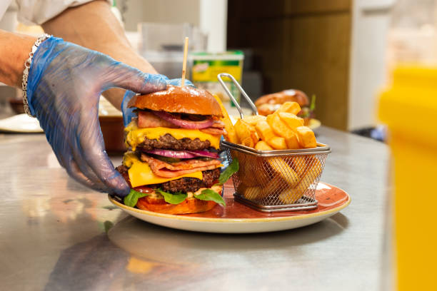 istock Preparing a Burger Dish with Fries 1440809944