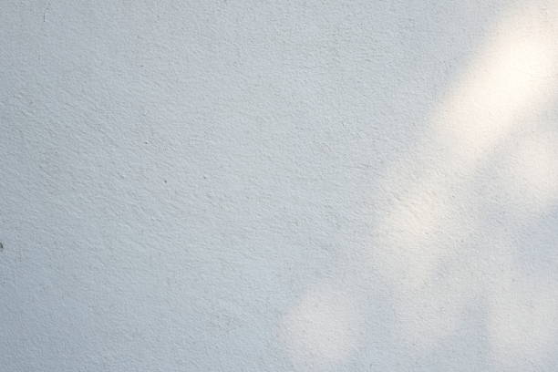 istock Light Beam on Surface of Concrete Wall Background. 1440810892