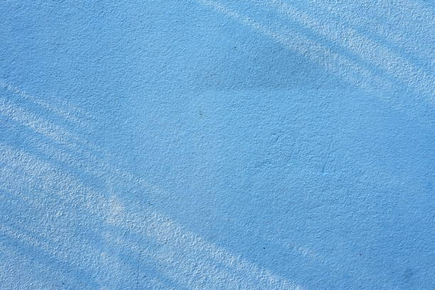 istock Sun Light Beam on Surface of Blue Concrete Wall Background. 1440810912