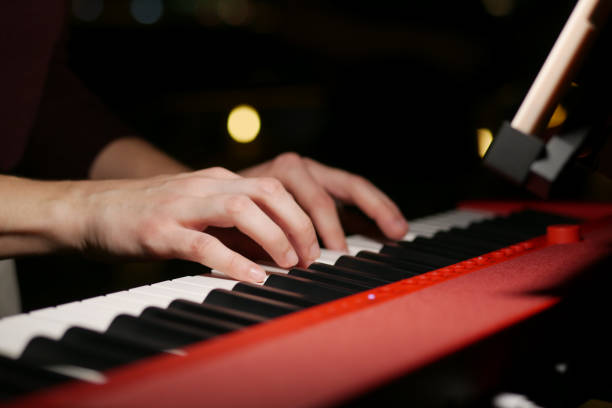 istock women hands playing grand piano at night 1440815341
