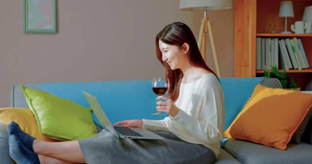 istock asian woman enjoying wine 1440815537