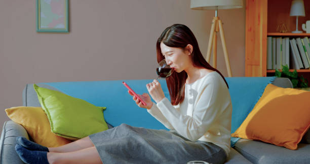 istock asian woman enjoying wine 1440815581