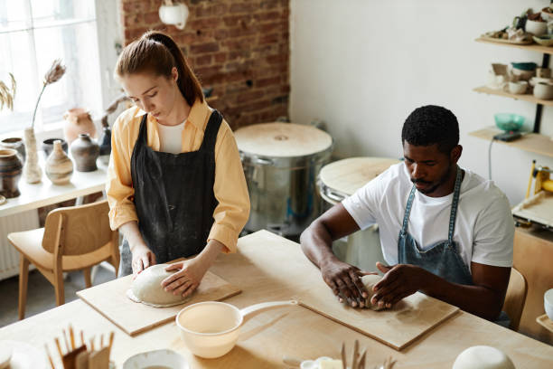 istock Two people making handmade ceramics in cozy pottery studio 1440817529