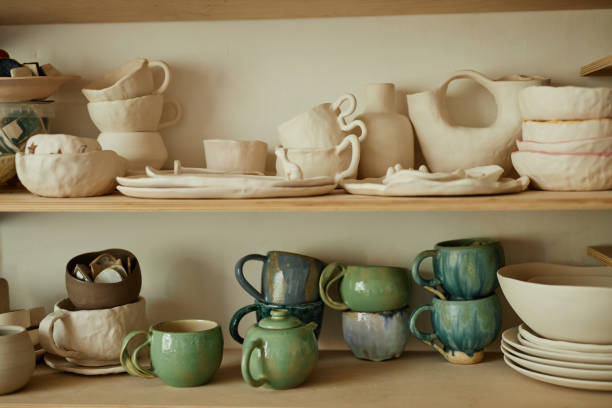 istock Wooden shelves with handmade ceramic cups and tea sets 1440817565