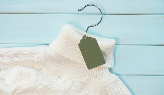 White knit sweater with tag