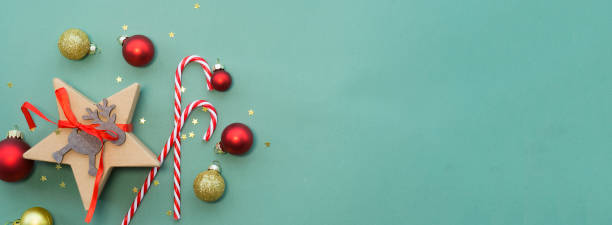 istock Christmas banner with a gift, Christmas balls and candy canes 1440818785