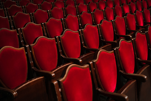 a row of chairs in the theater hall close-up