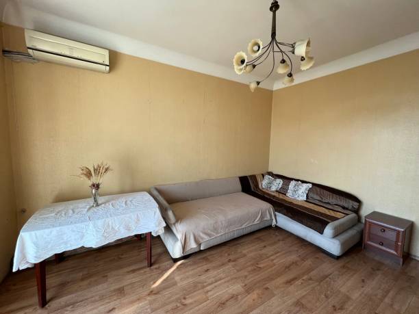 istock Old living room with big corner sofa 1440823435
