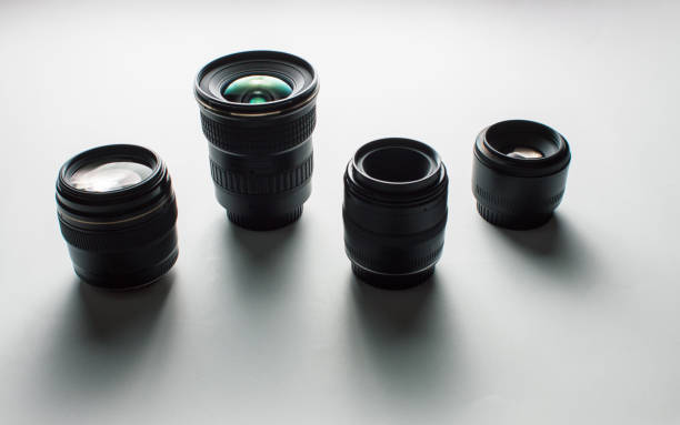 istock close-up view of a group of camera lenses on a white surface 1440823758