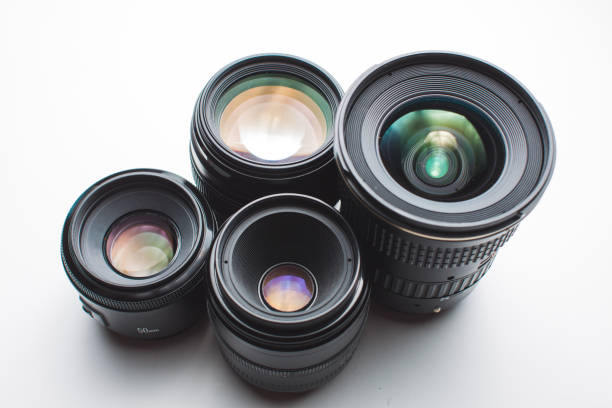 istock close-up view of a group of camera lenses on a white surface 1440823764
