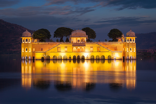Rajasthan landmark - Jal Mahal (Water Palace) on Man Sagar Lake in the evening in twilight. Jaipur, Rajasthan, India
