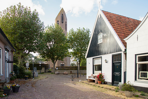 Texel, Netherlands, October 18, 2022; Narrow street in the smallest village on the island of Texel, De Waal.