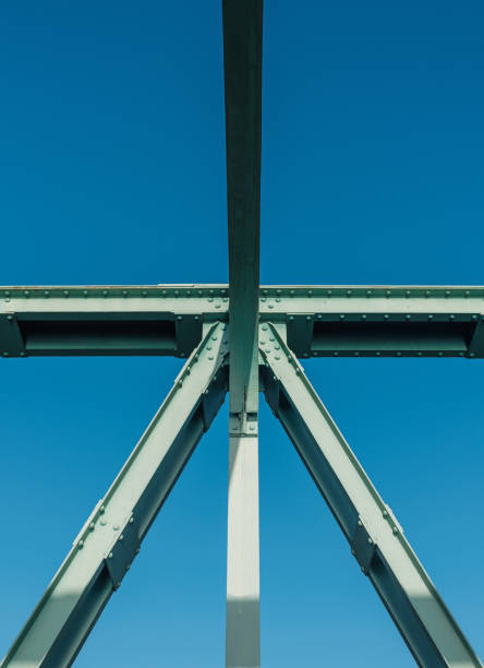 Rivet details of a green Pratt Truss bridge