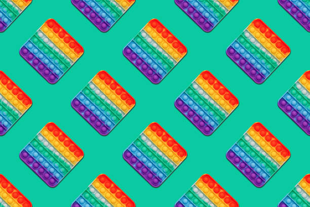 istock Pop it, Rainbow antistress toy, seamless pattern, flat lay. 1440827896