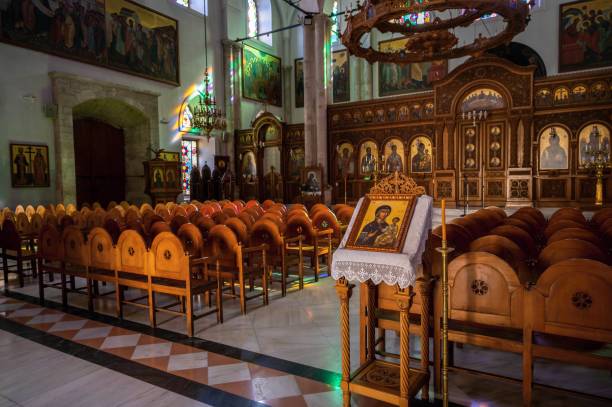Nice wooden armchair in main nave with altare in church of Agios Titos, Heraklion. stock photo