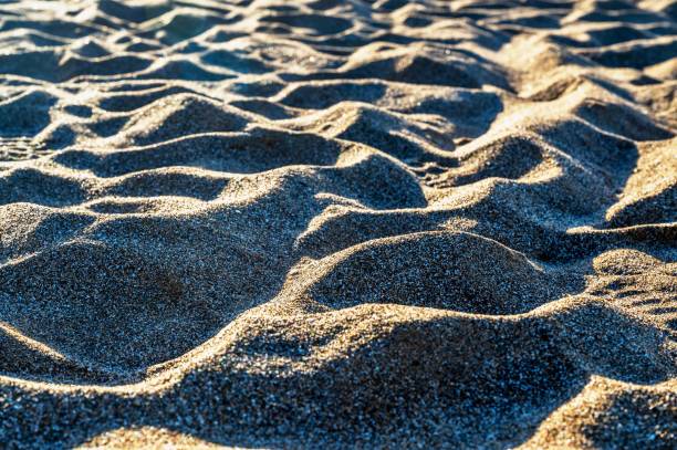 Shapes of sand in sunset on beach. stock photo