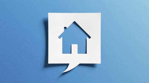 House symbol for real estate and housing concepts, buy or sell home, become homeowner, mortgage, maintenance, repair, refurbish, investment, property market. Cutout paper on blue background. stock photo