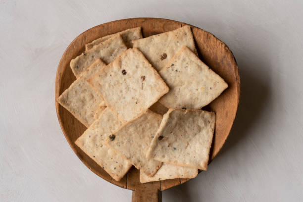 istock Brown Rice Crackers on a Wood Paddle 1440836678