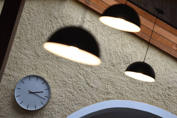 istock Clock on the Wall and Lamps Above 1440836782