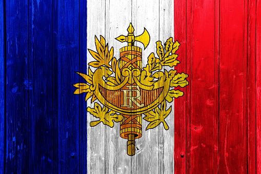 Flag and coat of arms of France on a textured background. Concept collage.