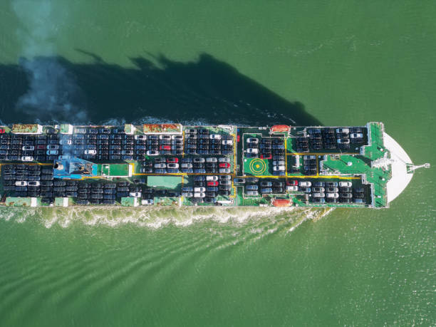 Vessels for transporting cars and ro-ro boats. View from above. The ship delivers new cars stock photo