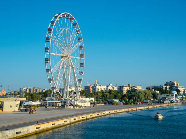 Rimini, Italy - August 01, 2022: Ferris wheel at the Adriatic Sea in Rimini - a city in the Emilia-Romagna region of northern Italy and capital city of the Province of Rimini.