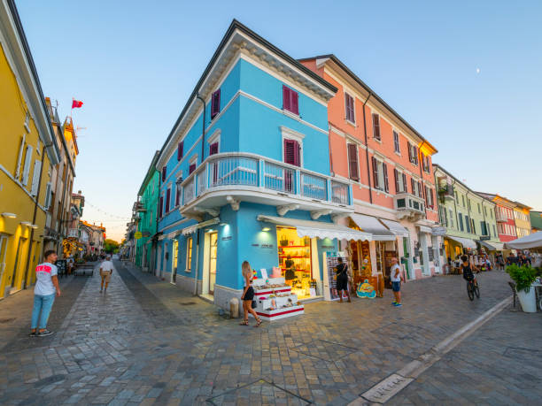 Cesenatico, Italy - August 04, 2022: Pedestrians walking on streets in the old tourist part of the town. Cesenatico is a port town on the Adriatic coast of Italy. It is located in the province of Forlì-Cesena in the region of Emilia-Romagna, about 30 kilometres south of Ravenna.