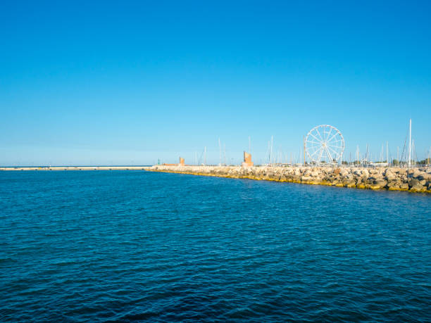 Sea breakwater at the embankment surrounding the docks in Rimini - a city in the Emilia-Romagna region of northern Italy and capital city of the Province of Rimini.