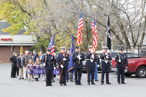 Veterans Day Celebration Held in Arlington, MA, US on Friday, November 11, 2022.\nMarch started at 10:30AM, from Walgreens (324 Massachusetts Avenue) to the central fire station. , Participated including: Veterans, girl scout, town officials, Minuteman group, Police men.